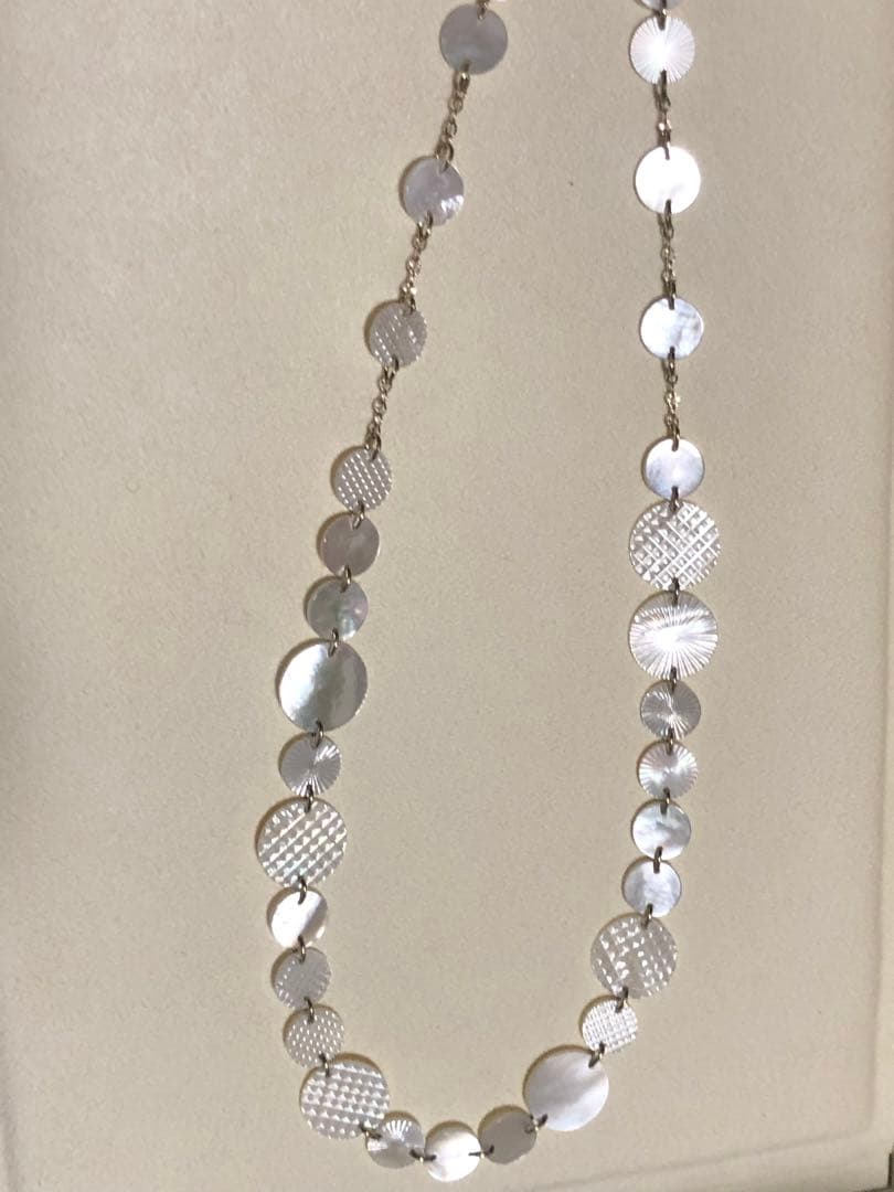 Agete white shell long necklace with silver and gold plated chain shown at 90cm length