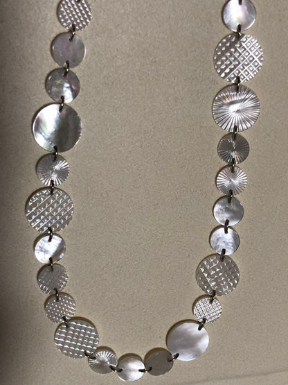 Agete white shell long necklace with silver and gold plated chain shown at 90cm length