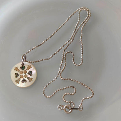 agetE shell charm necklace with heart and cross in sterling silver with white mother of pearl charm