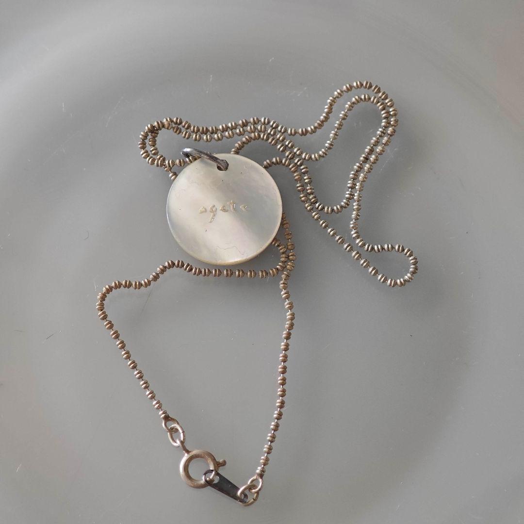 agetE shell charm necklace with heart and cross in sterling silver with white mother of pearl charm