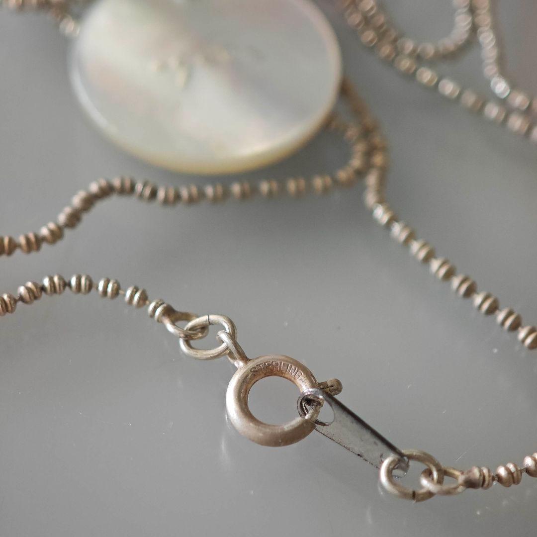 agetE shell charm necklace with heart and cross in sterling silver with white mother of pearl charm