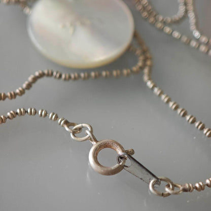 agetE shell charm necklace with heart and cross in sterling silver with white mother of pearl charm