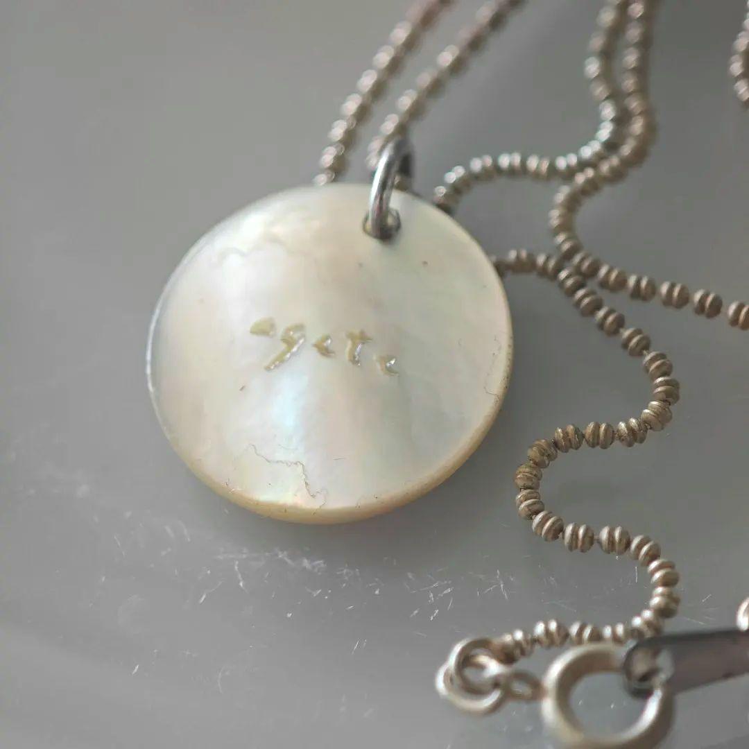agetE shell charm necklace with heart and cross in sterling silver with white mother of pearl charm