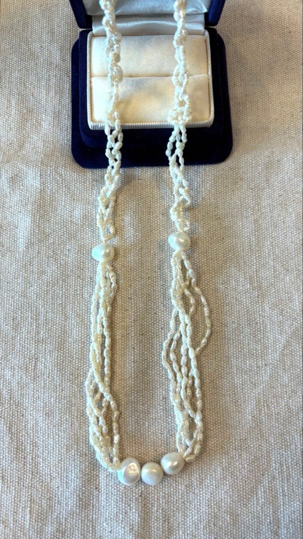 Agete freshwater pearl necklace made of K10 gold with a 60 cm length displayed on a white background