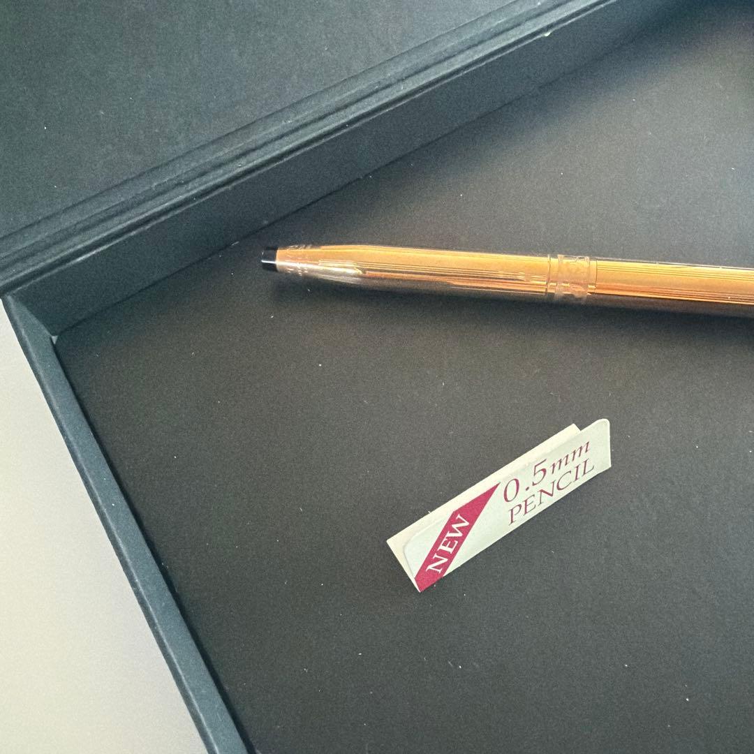 Cross brand 0.5mm gold color mechanical pencil shown on white background