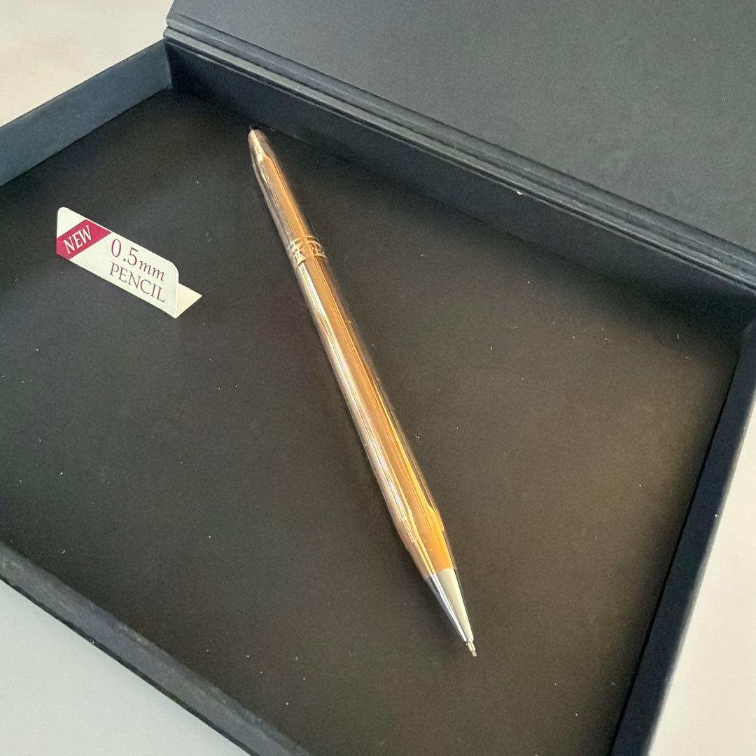 Cross brand 0.5mm gold color mechanical pencil shown on white background