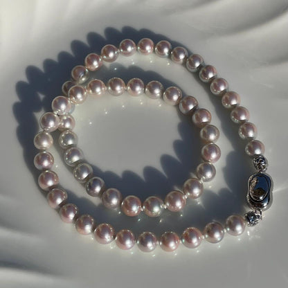 Akoya pearl necklace with 7.5-8mm blue tone pearls and silver clasp displayed with certification and box