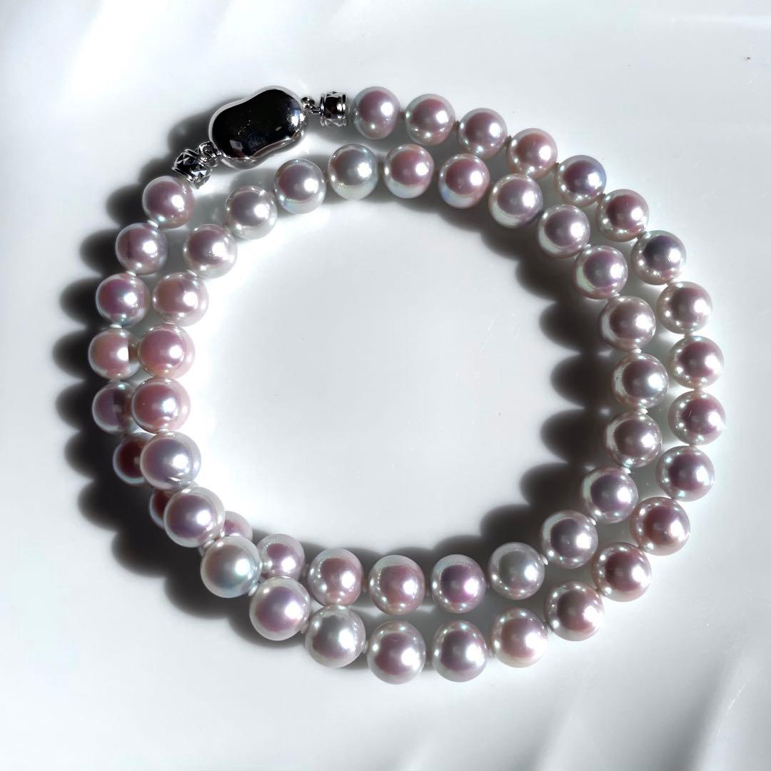 Akoya pearl necklace with 7.5-8mm blue tone pearls and silver clasp displayed with certification and box