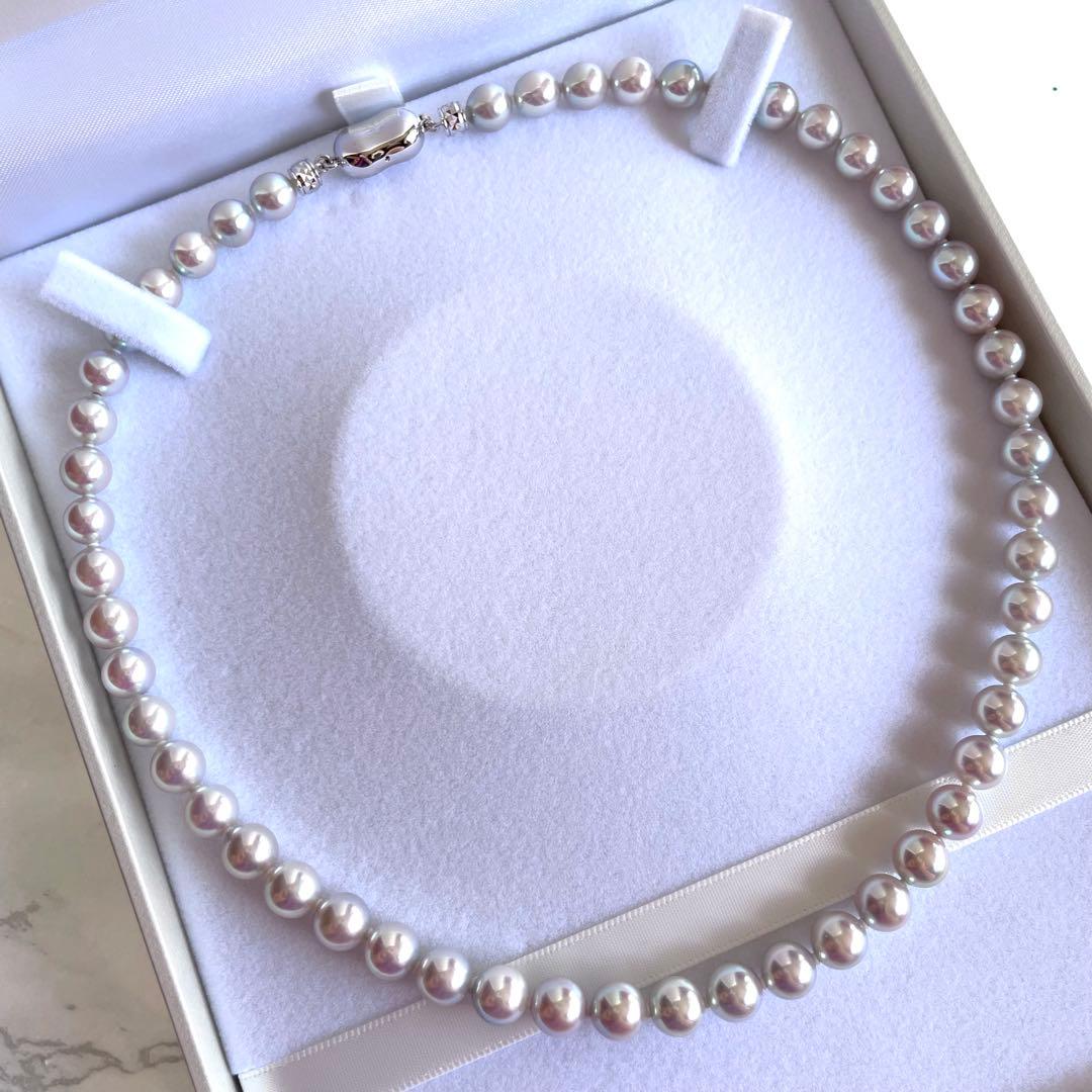 Akoya pearl necklace with 7.5-8mm blue tone pearls and silver clasp displayed with certification and box