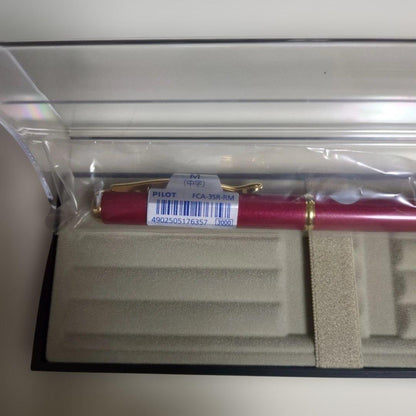 Red metal Pilot FCA-53R-RM fountain pen with included case on white background