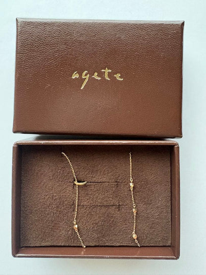Agate square-beaded gold necklace approximately 75cm long with adjustable chain and guarantee certificate