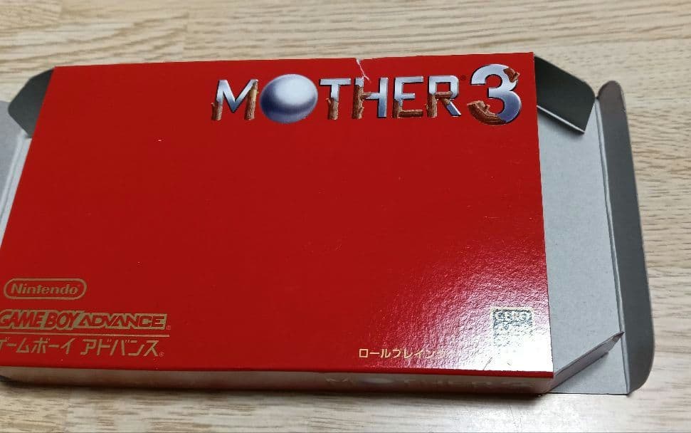 MOTHER3 and MOTHER1+2 game cartridges set with visible scratch on one cartridge