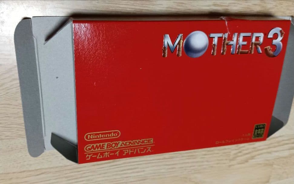 MOTHER3 and MOTHER1+2 game cartridges set with visible scratch on one cartridge