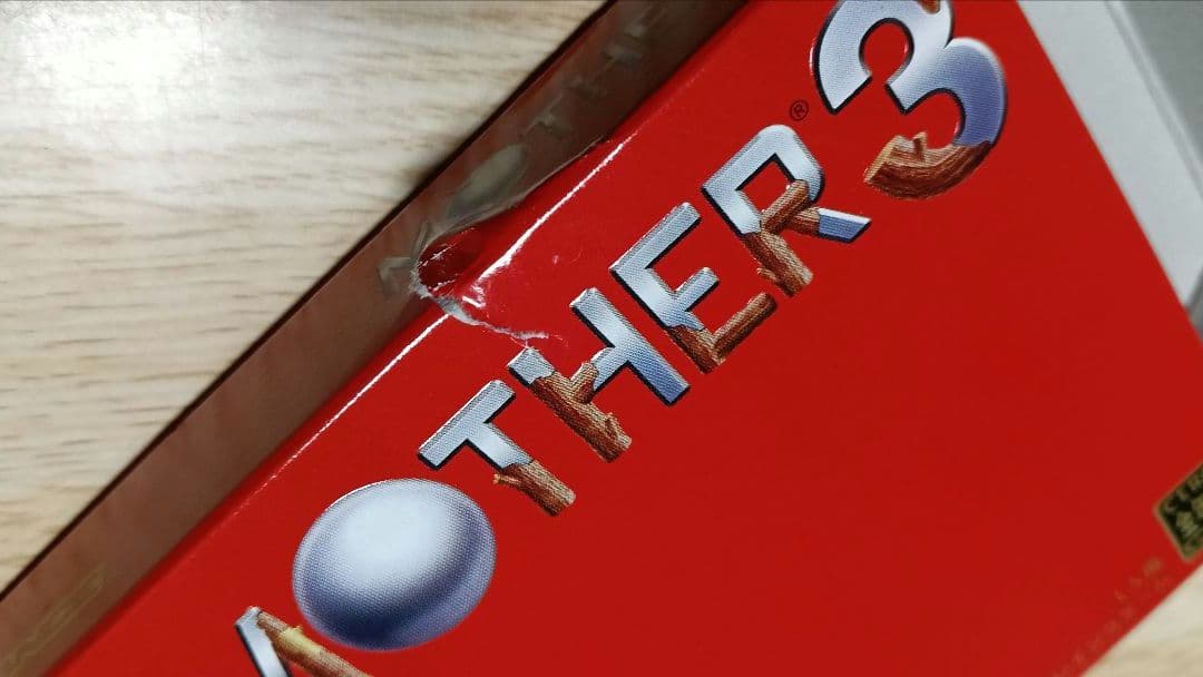 MOTHER3 and MOTHER1+2 game cartridges set with visible scratch on one cartridge
