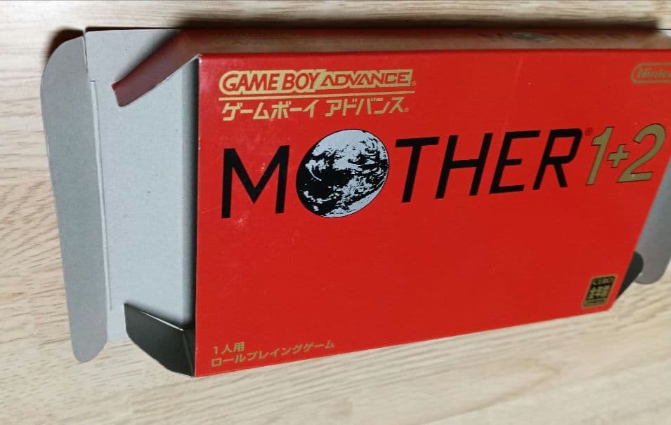 MOTHER3 and MOTHER1+2 game cartridges set with visible scratch on one cartridge