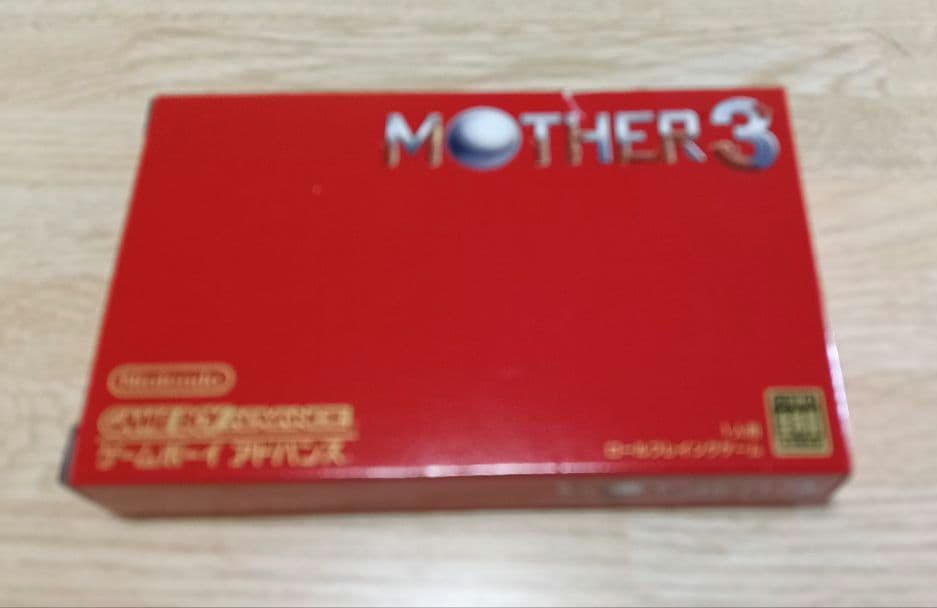 MOTHER3 and MOTHER1+2 game cartridges set with visible scratch on one cartridge
