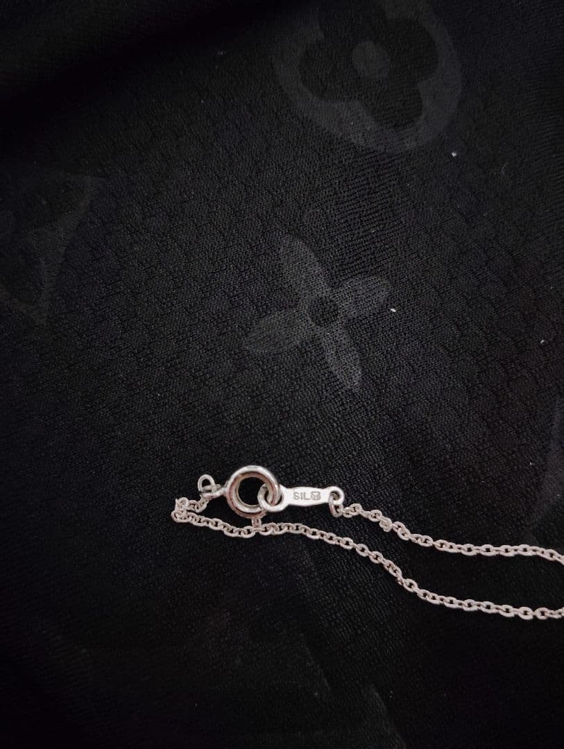 Mikimoto baby pearl necklace with heart-shaped silver pendant marked with M and SIL, length approximately 40cm