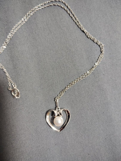 Mikimoto baby pearl necklace with heart-shaped silver pendant marked with M and SIL, length approximately 40cm