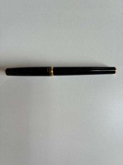 Pilot black fountain pen with medium gold-plated nib and included box, manual, and ink cartridges