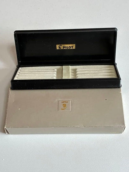 Pilot black fountain pen with medium gold-plated nib and included box, manual, and ink cartridges
