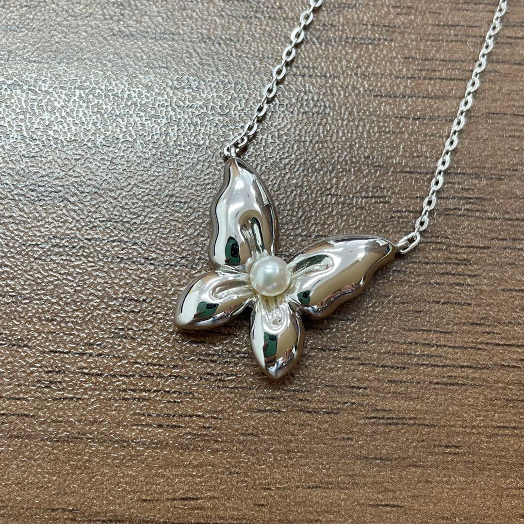 Mikimoto Pearl Butterfly necklace featuring a delicate chain and butterfly pendant with pearl accents