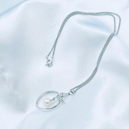 Mikimoto pearl pendant necklace featuring a 6.5mm pearl with 2x3cm pendant on a 39cm chain