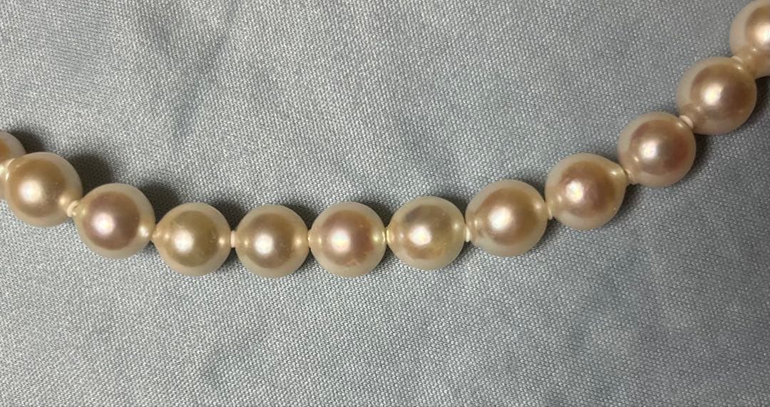 Takashimaya Akoya pearl necklace and earrings set featuring 8-8.5mm slightly pinkish and white pearls with silver clasp