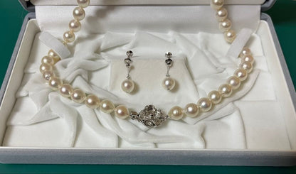 Takashimaya Akoya pearl necklace and earrings set featuring 8-8.5mm slightly pinkish and white pearls with silver clasp