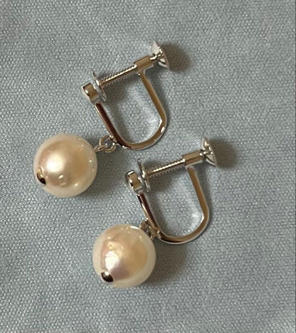 Takashimaya Akoya pearl necklace and earrings set featuring 8-8.5mm slightly pinkish and white pearls with silver clasp