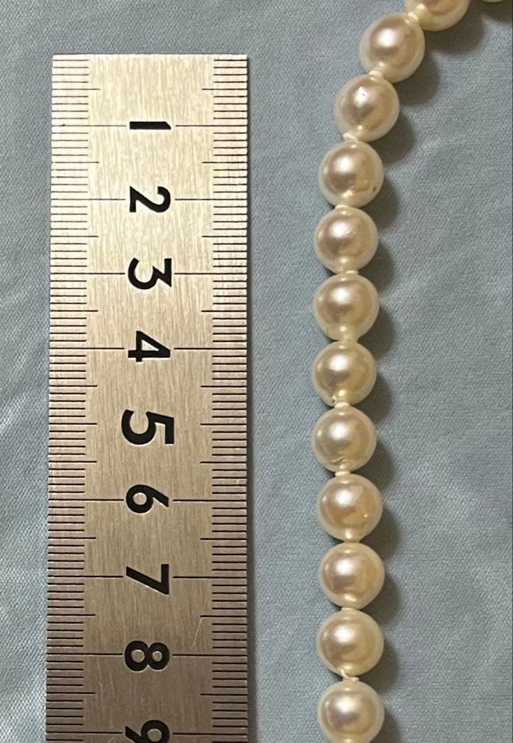 Takashimaya Akoya pearl necklace and earrings set featuring 8-8.5mm slightly pinkish and white pearls with silver clasp