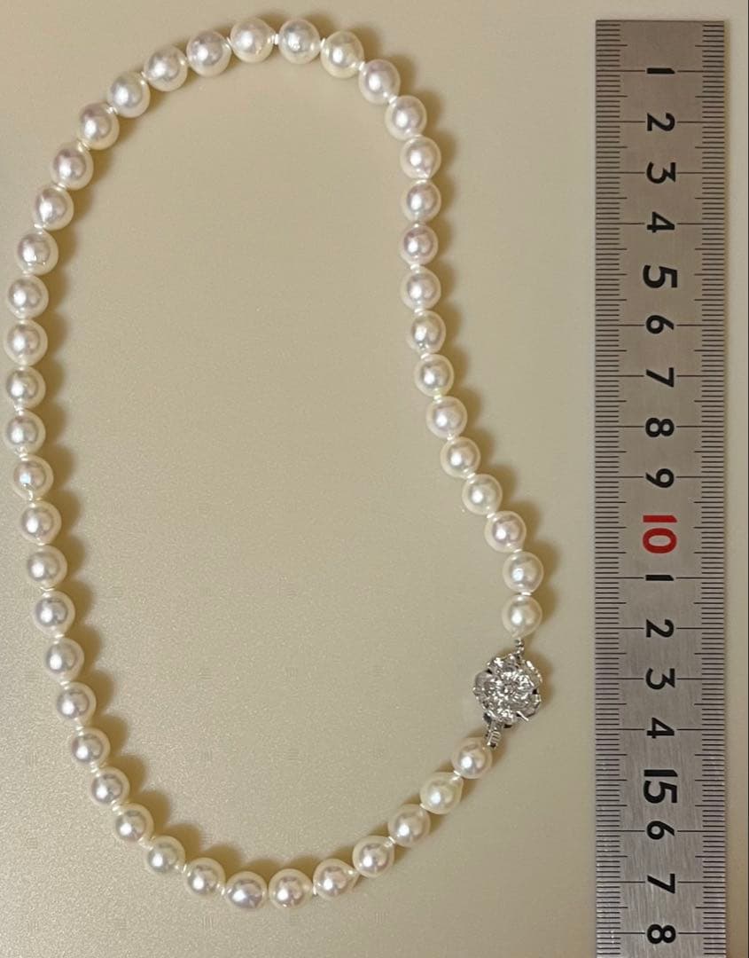 Takashimaya Akoya pearl necklace and earrings set featuring 8-8.5mm slightly pinkish and white pearls with silver clasp