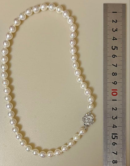 Takashimaya Akoya pearl necklace and earrings set featuring 8-8.5mm slightly pinkish and white pearls with silver clasp