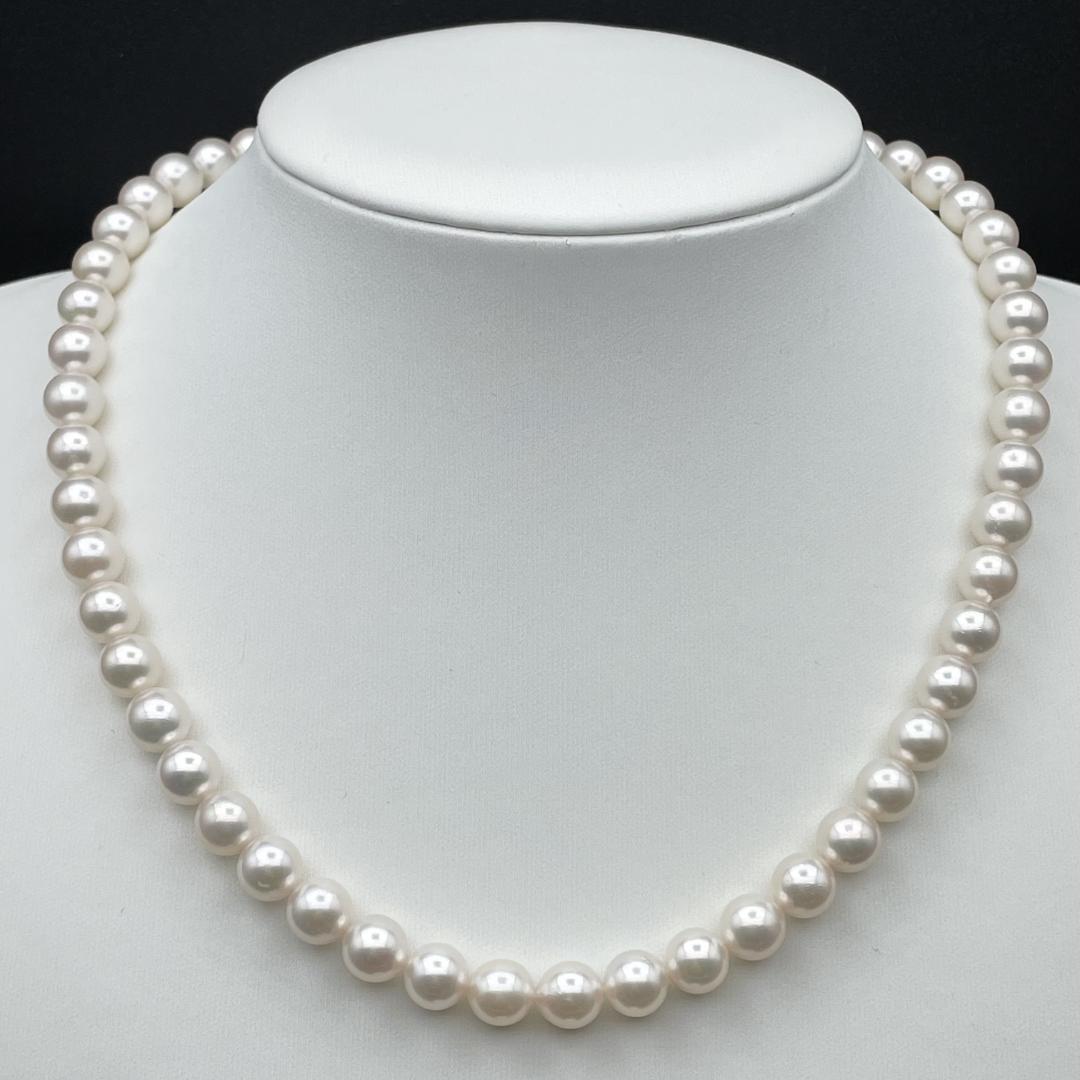 Akoya pearl necklace with 7-8mm pearls and silver clasp displayed on white background