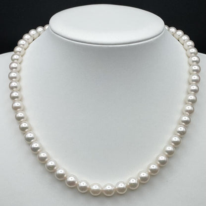 Akoya pearl necklace with 7-8mm pearls and silver clasp displayed on white background
