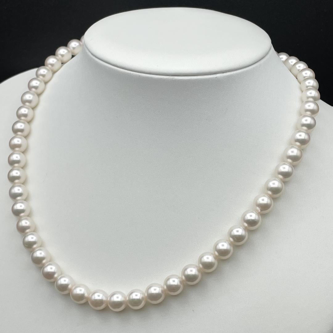 Akoya pearl necklace with 7-8mm pearls and silver clasp displayed on white background