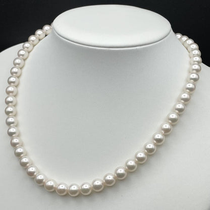 Akoya pearl necklace with 7-8mm pearls and silver clasp displayed on white background
