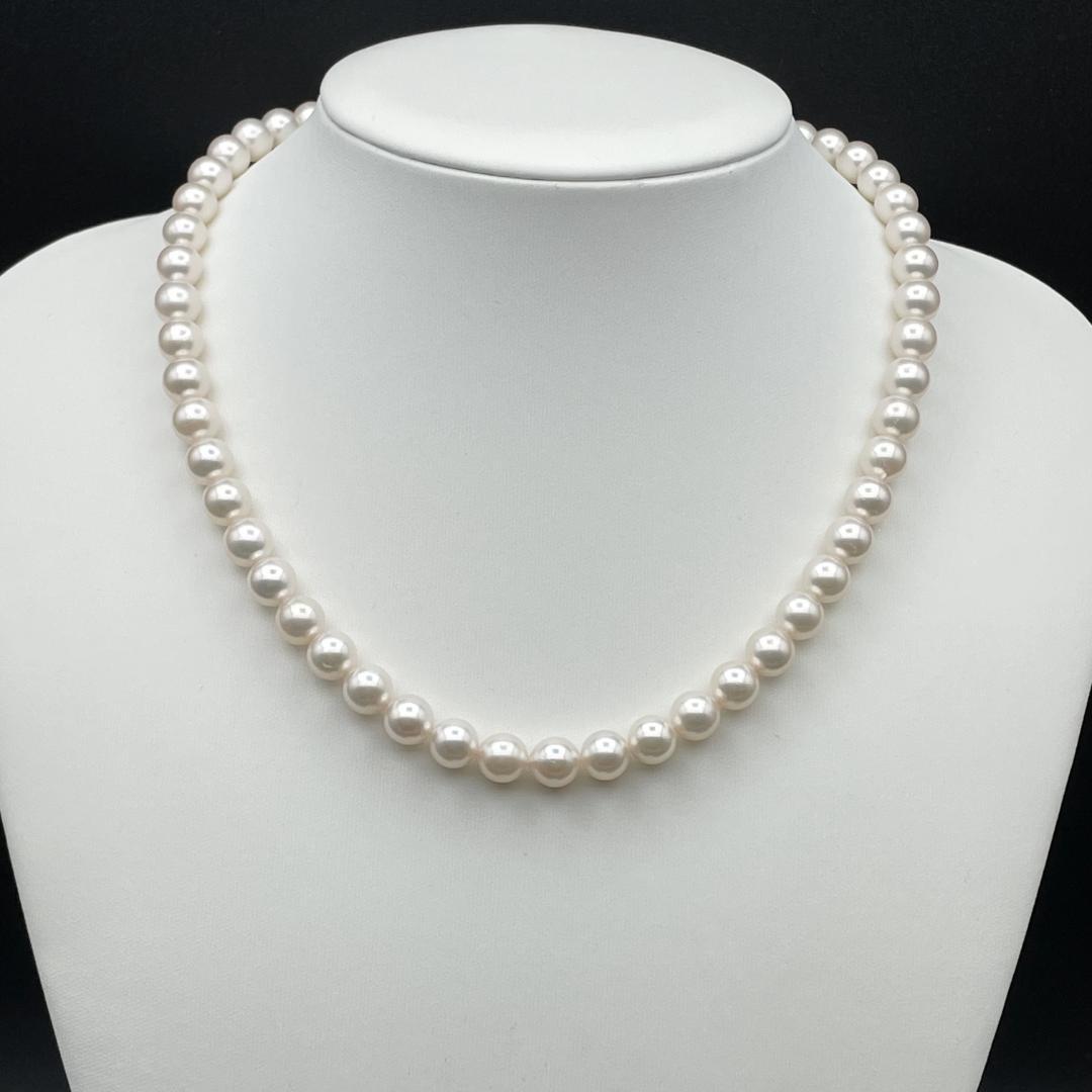 Akoya pearl necklace with 7-8mm pearls and silver clasp displayed on white background