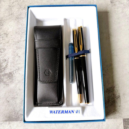 Waterman fountain pen and ballpoint pen set with leather case, displayed in original packaging with slight box discoloration