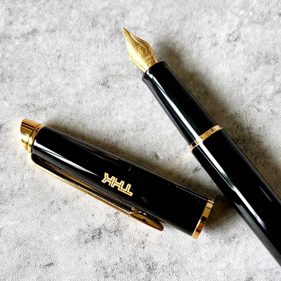 Waterman fountain pen and ballpoint pen set with leather case, displayed in original packaging with slight box discoloration