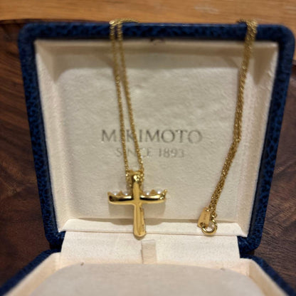 Kuro Cross Cross Shape necklace in K18YG yellow gold with pearl accents on a white background