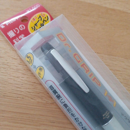 Pilot Dr. Grip 1+1 black multi-function pen with 0.5mm tip, new and unused, shown with packaging
