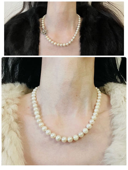 Aukoya pearl necklace with large 8.5mm round pearls and silver princess clasp on a white background