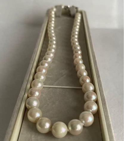 Aukoya pearl necklace with large 8.5mm round pearls and silver princess clasp on a white background