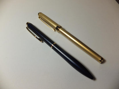 Used PILOT DRIVE ballpoint pen in navy color shown from side view