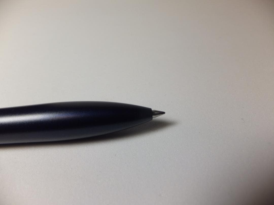 Used PILOT DRIVE ballpoint pen in navy color shown from side view