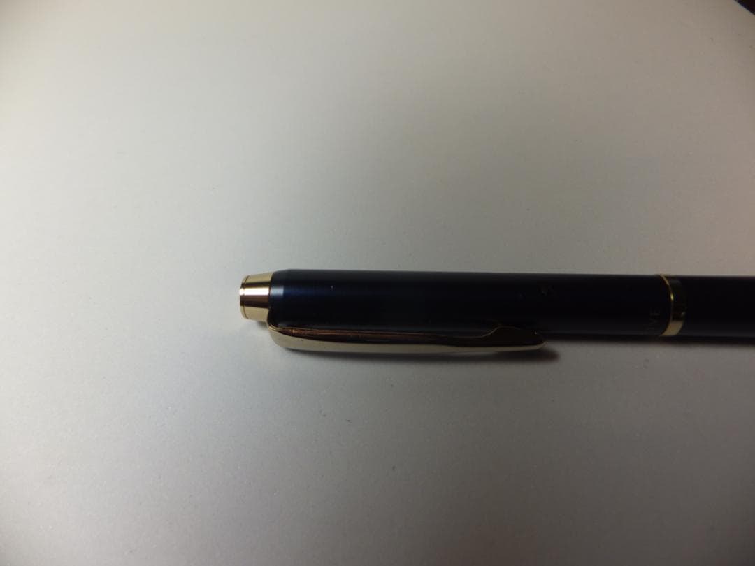 Used PILOT DRIVE ballpoint pen in navy color shown from side view