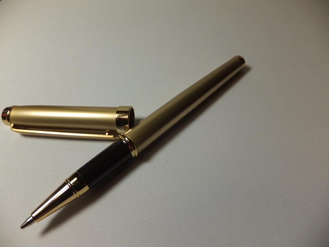 Used PILOT DRIVE ballpoint pen in navy color shown from side view