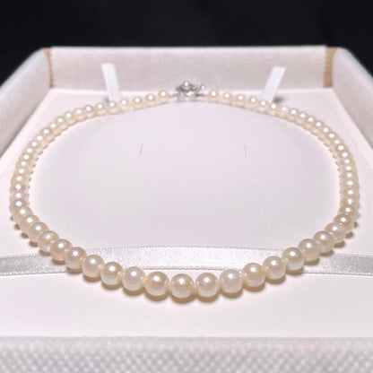 Irregular Ise-Shima Akoya pearl necklace with 5.9-6.3mm round pearls on a silver chain, 42.2 cm long