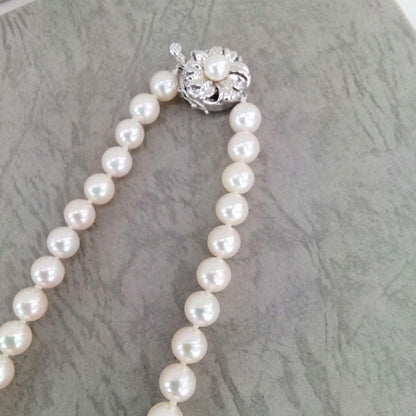 Akoya pearl necklace, ring, and earring set with silver necklace and platinum ring and earrings
