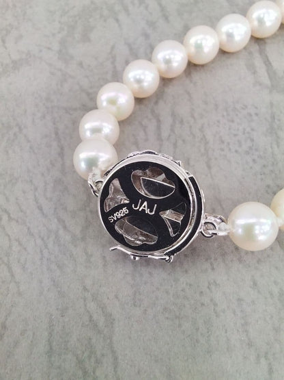 Akoya pearl necklace, ring, and earring set with silver necklace and platinum ring and earrings